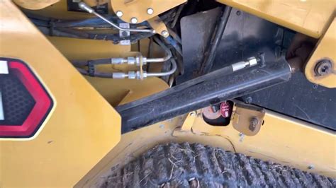 cat skid steer hydraulic oil drain|cat 259b3 hydraulic drain location.